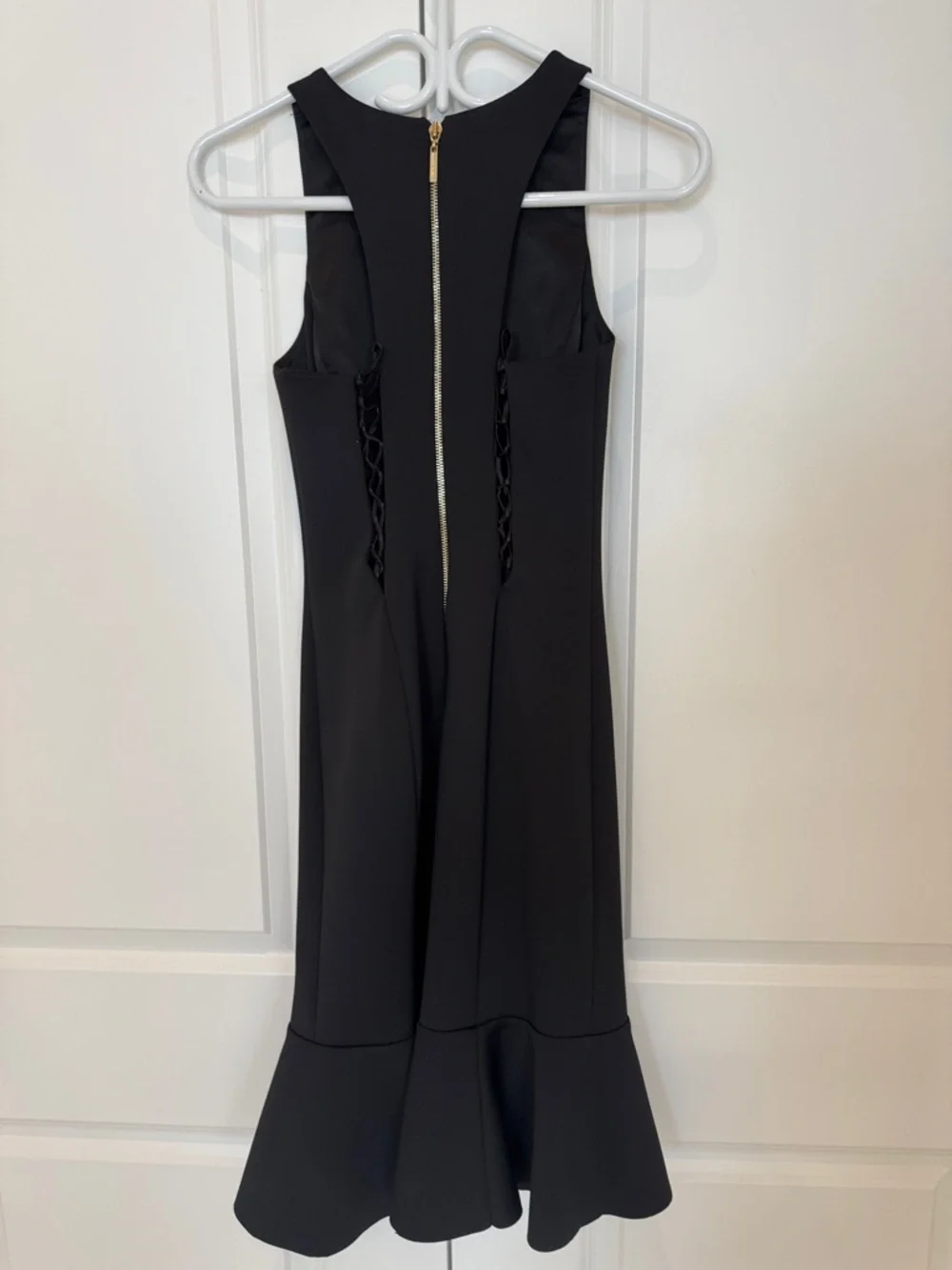Sleeveless Black Sheath Dress with Fluted Hem - Picture 2 of 3